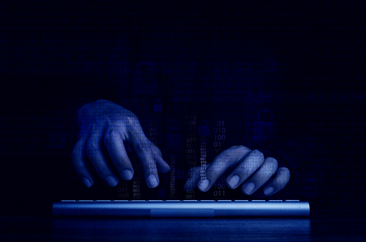 Cyberattack and internet crime, hacking and malware concepts. Digital binary code data numbers and secure lock icons on hacker' hands working with keyboard computer on dark blue tone background dark web SafePoint IT