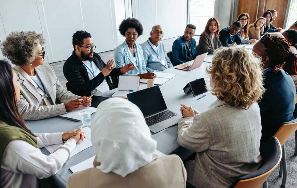 IT Support team at conference table discussing cybersecurity