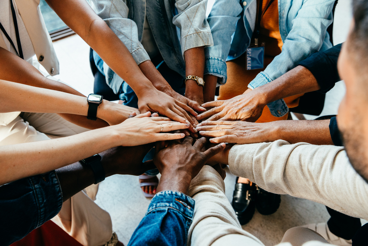 Team hands in at nonprofit.