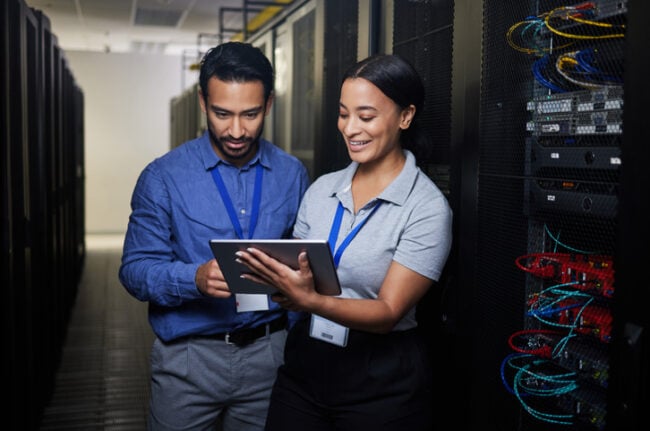 IT professionals working in an IT server room.