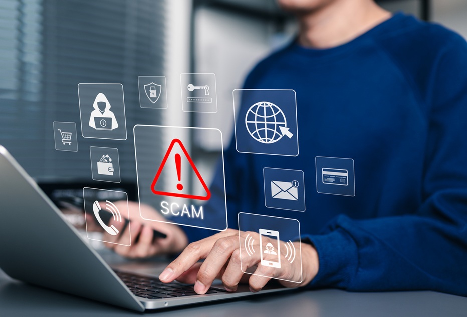 A person typing on a laptop with an overlay of cybersecurity risk graphics.