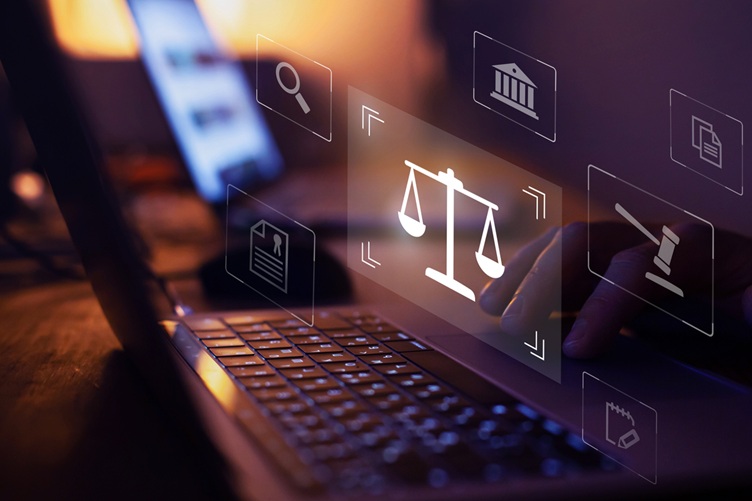A person typing with an overlap of legal IT related graphics.